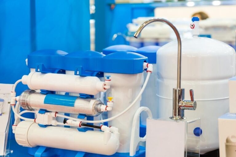 Whole-house water filtration tanks and filter housings on a home water line